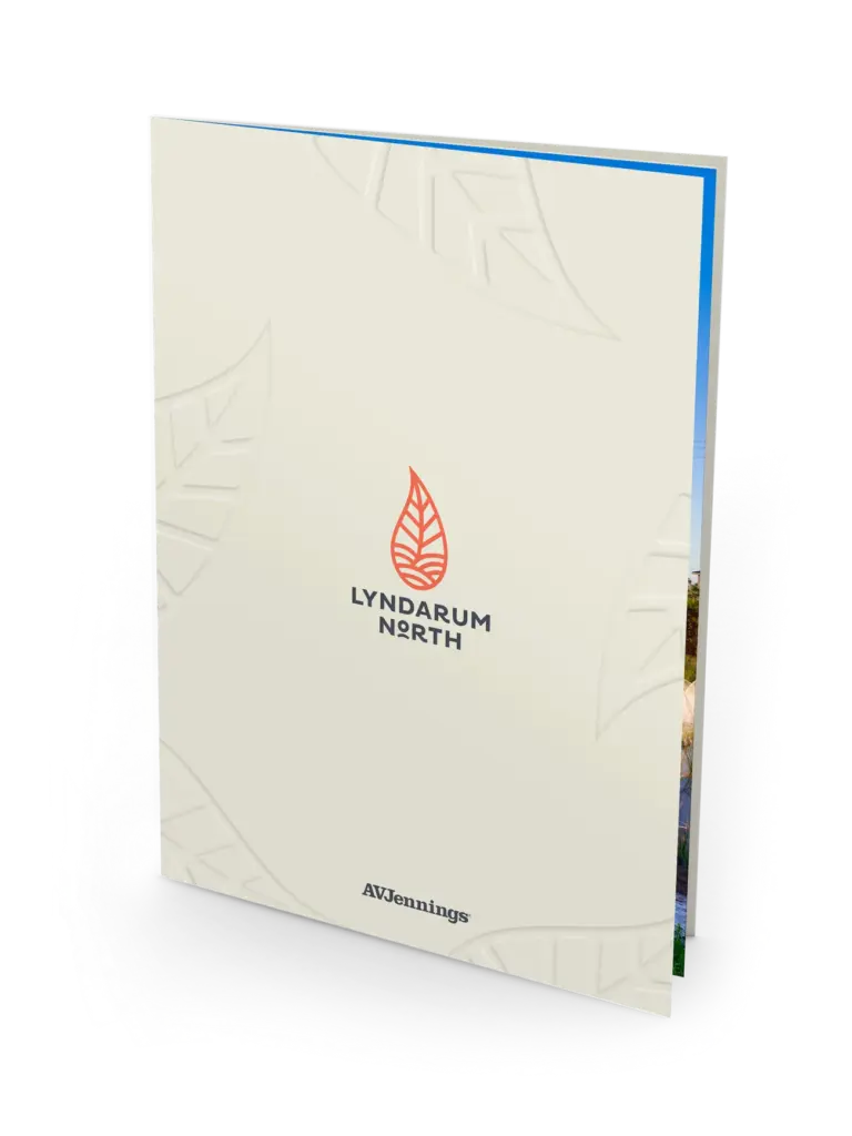 A cream-colored folder with a red leaf logo and the text "LYNDARUM NORTH" on the front, along with the "AVJennings" logo at the bottom. Subtle leaf patterns are embossed in the background.