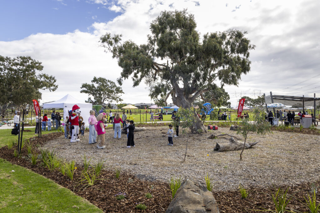 Families enjoying community event in suburban park