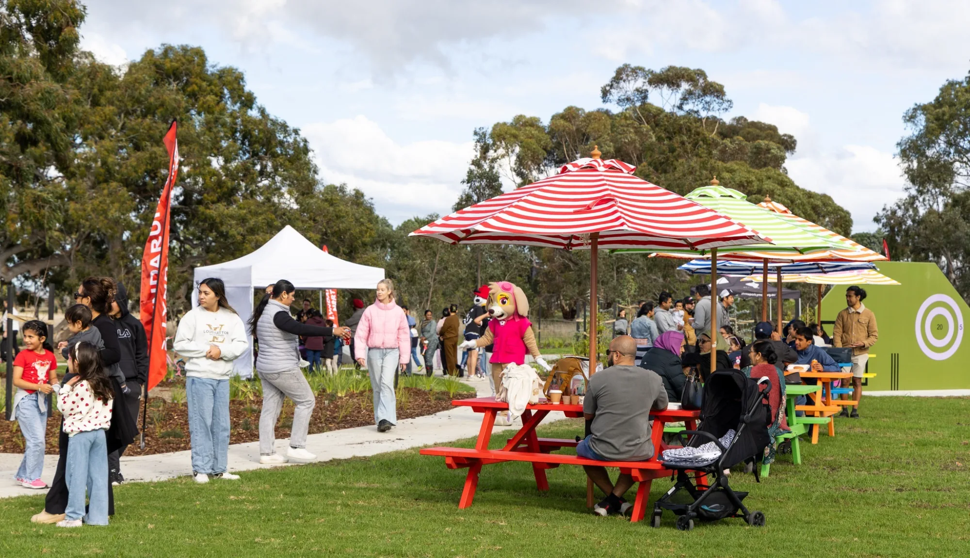 Families enjoying outdoor community event in park